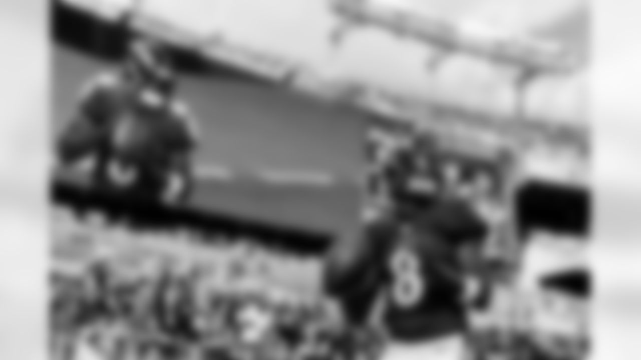 QB Lamar Jackson (8) warms up before a game against the Los Angeles Chargers at M&T Bank Stadium on October 17, 2021.