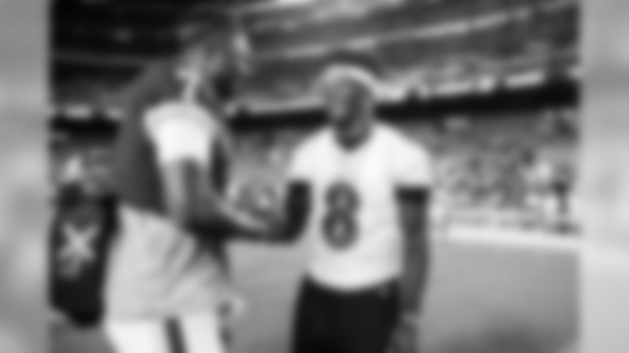 Quarterback Lamar Jackson shakes hands with an opposing player after the preseason game against the Washington Redskins on August 29, 2019.