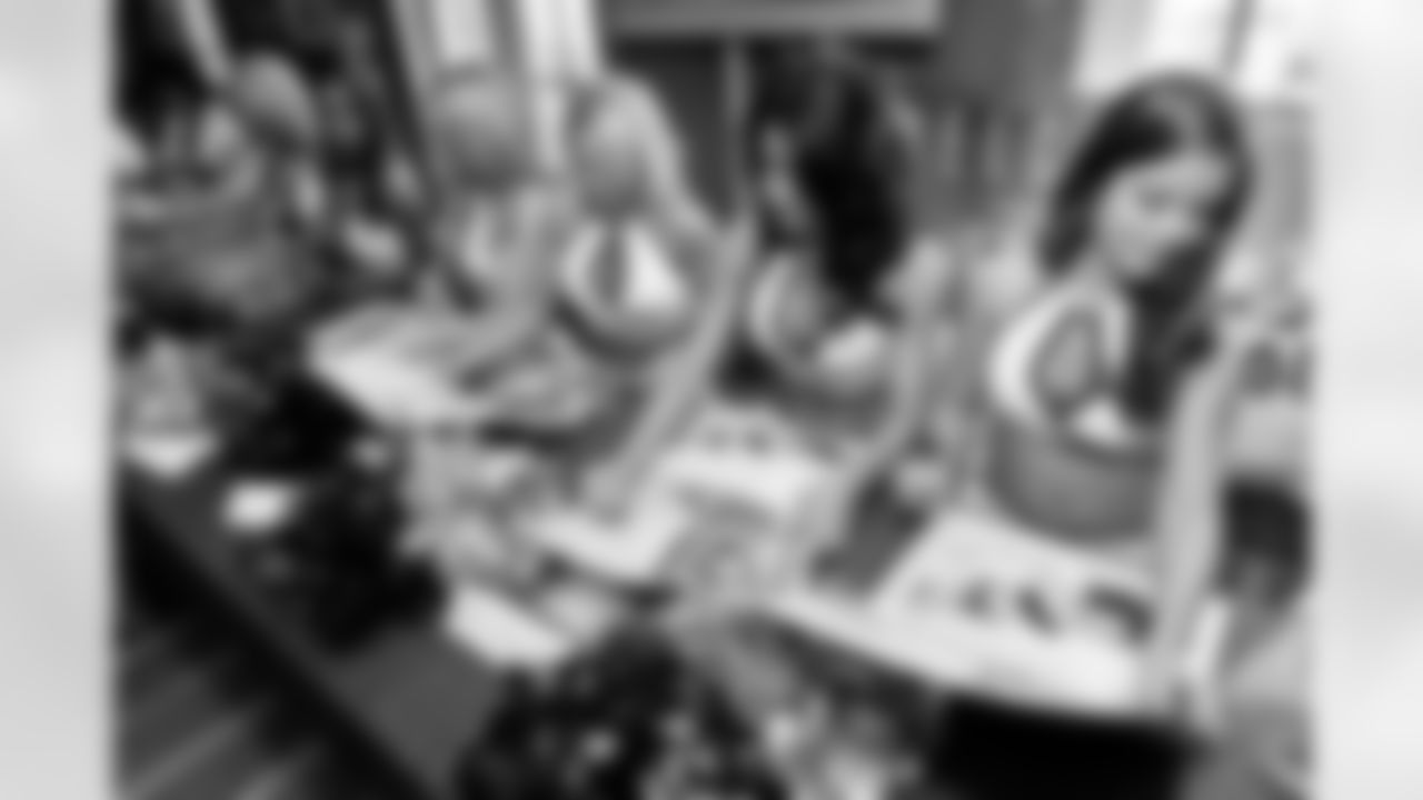 The Baltimore Ravens Cheerleaders gather at High Topps Backstage Grille in Timonium, MD to autograph swimsuit calendars in 2008.