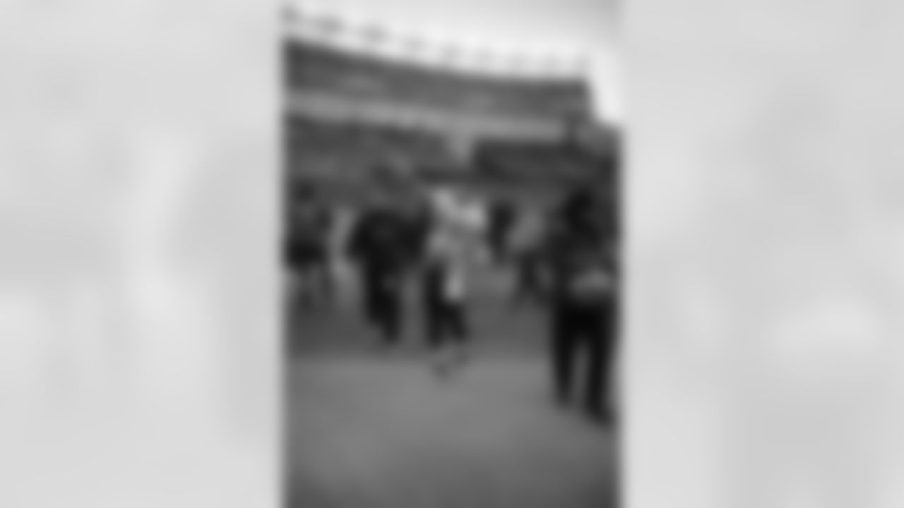 The Ravens celebrate their their historic 33-14 wild card win in New England. Head Coach John Harbaugh high-fived Ravens fans around the edge of the stadium before joining his team in the locker room.