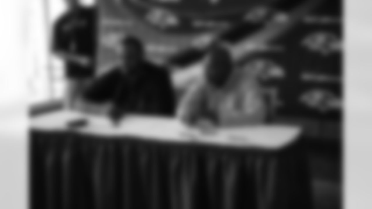 Tackle Michael Oher and General Manager & Executive VP Ozzie Newsome talk with the media during a press conference following the first-round draft pick's signing.