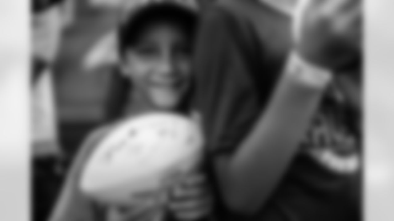 A young Ravens fan poses for a picture.