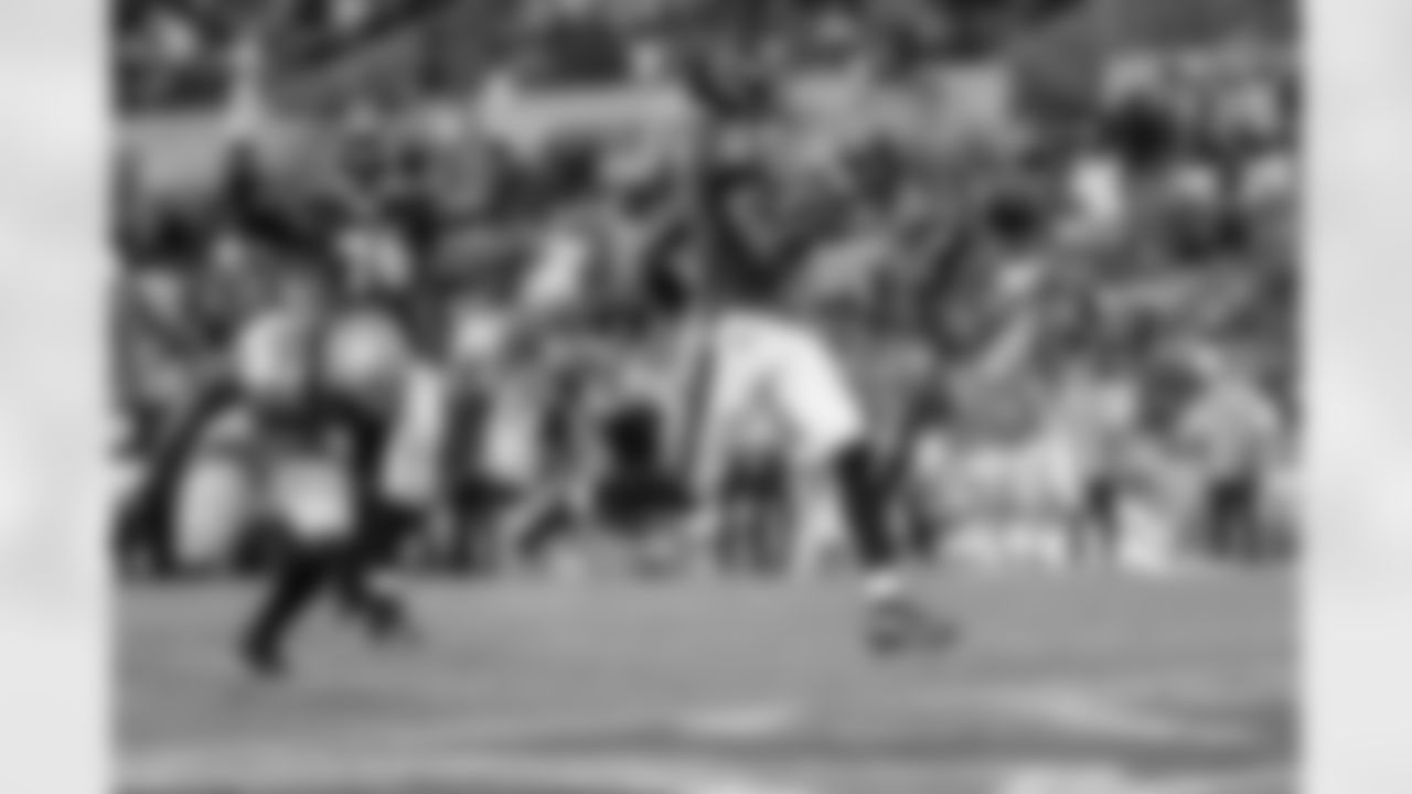 QB Tyler Huntley runs into the end zone for a touchdown
