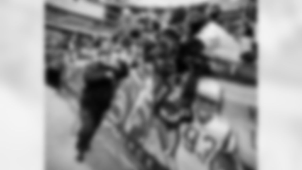 The Ravens celebrate their their historic 33-14 wild card win in New England. Head Coach John Harbaugh high-fived Ravens fans around the edge of the stadium before joining his team in the locker room.