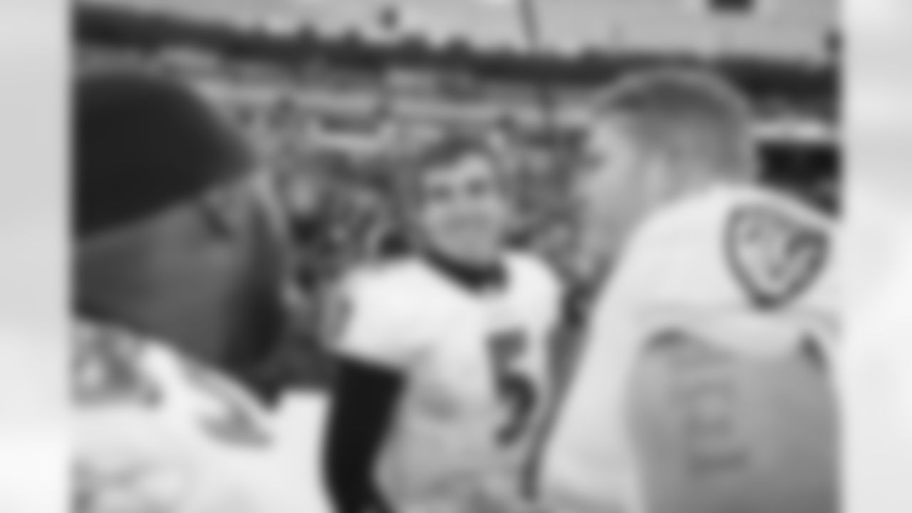 The Ravens celebrate their their historic 33-14 wild card win in New England. Head Coach John Harbaugh high-fived Ravens fans around the edge of the stadium before joining his team in the locker room.