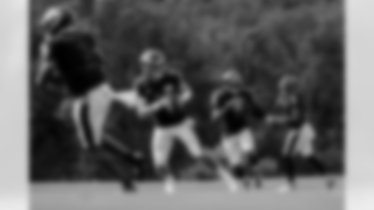 Quarterbacks warm up