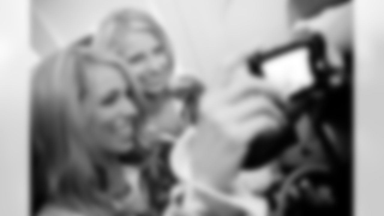 Kate and Richelle take a self portrait from their seats on the airplane.