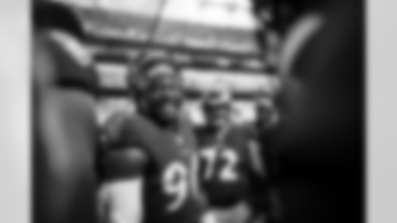 OLB Pernell McPhee (90) leads a team huddle before a game against the Los Angeles Chargers at M&T Bank Stadium on October 17, 2021.