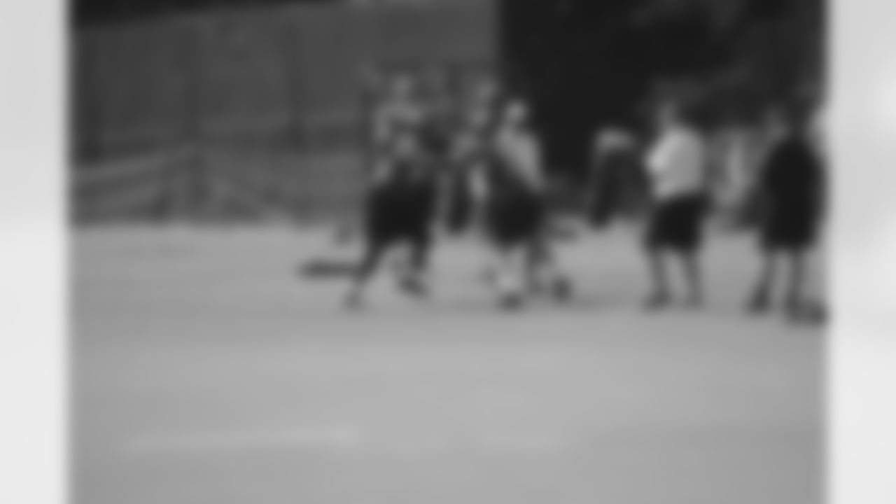 The defense engages in a drill at training camp practice.