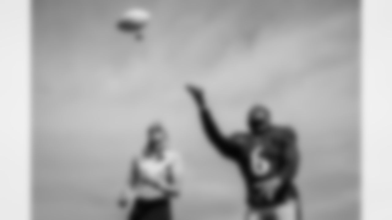 ILB Patrick Queen (6) throws autographed balls to fans at training camp on August 7, 2021.