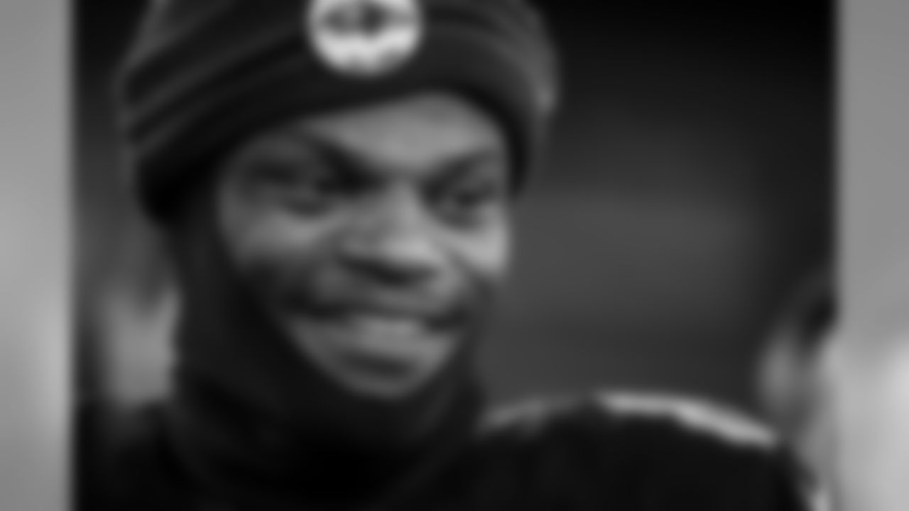 Quarterback Lamar Jackson smiles on the field after the Thursday Night Football game against the New York Jets on December 12, 2019.