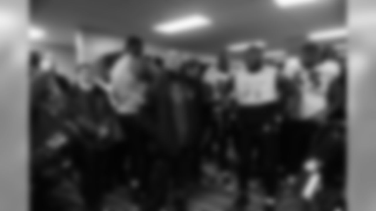 The Ravens celebrate their their historic 33-14 wild card win in New England. Head Coach John Harbaugh high-fived Ravens fans around the edge of the stadium before joining his team in the locker room.