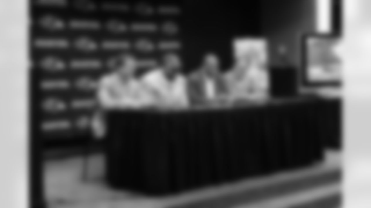 2009 Ravens first-round draft pick Michael Oher is introduced by GM Ozzie Newsome, Head Coach John Harbaugh and Director of Player Personnel Eric DeCosta at a press conference at the Ravens' Owings Mills Training Facility in April 2009.