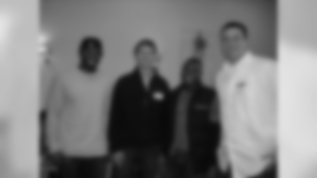 Derrick Martin delivered gifts with teammates Steve Hauschka, Marcus Maxwell and Joe Reitz at the local hospital's annual Holiday Party in December 2008.