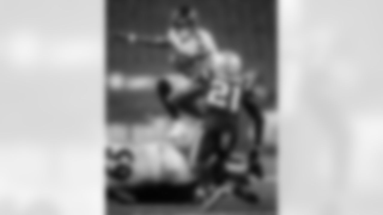 Baltimore Ravens QB Lamar Jackson (8) leaps over players against the New England Patriots on November 15, 2020 at Gillette Stadium