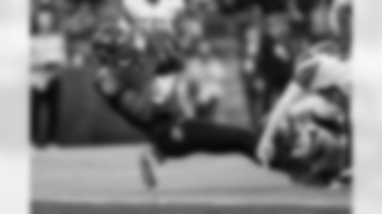 QB Lamar Jackson (8) falls into the end zone for a touchdown during a game against the Minnesota Vikings at M&T Bank Stadium on November 7, 2021.