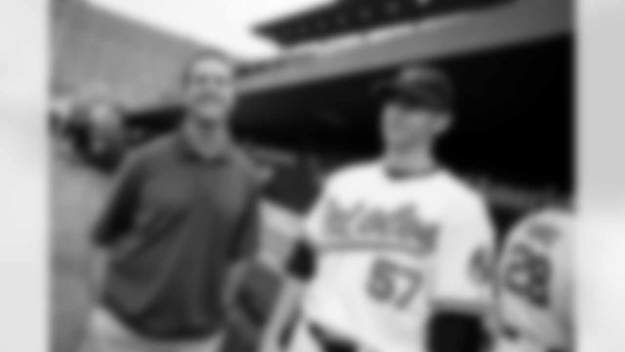 The Baltimore Ravens and Orioles partnered to present O's-Ravens Rally Night at Oriole Park at Camden Yards on Saturday, June 12. Ravens Head Coach John Harbaugh threw out the first pitch and the Ravens' mascot, Poe, cheerleaders and band, the Marching Ra