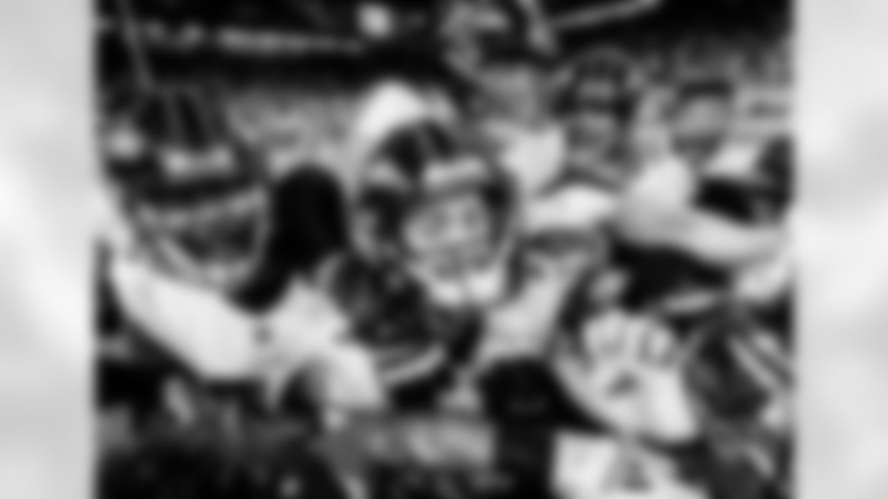 K Justin Tucker celebrates with teammates after kicking a game winning field goal