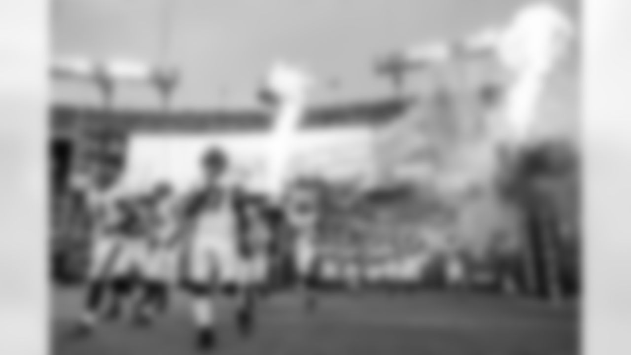 Players running out of the tunnel during the Baltimore Ravens vs. Washington Redskins Preseason Game 1