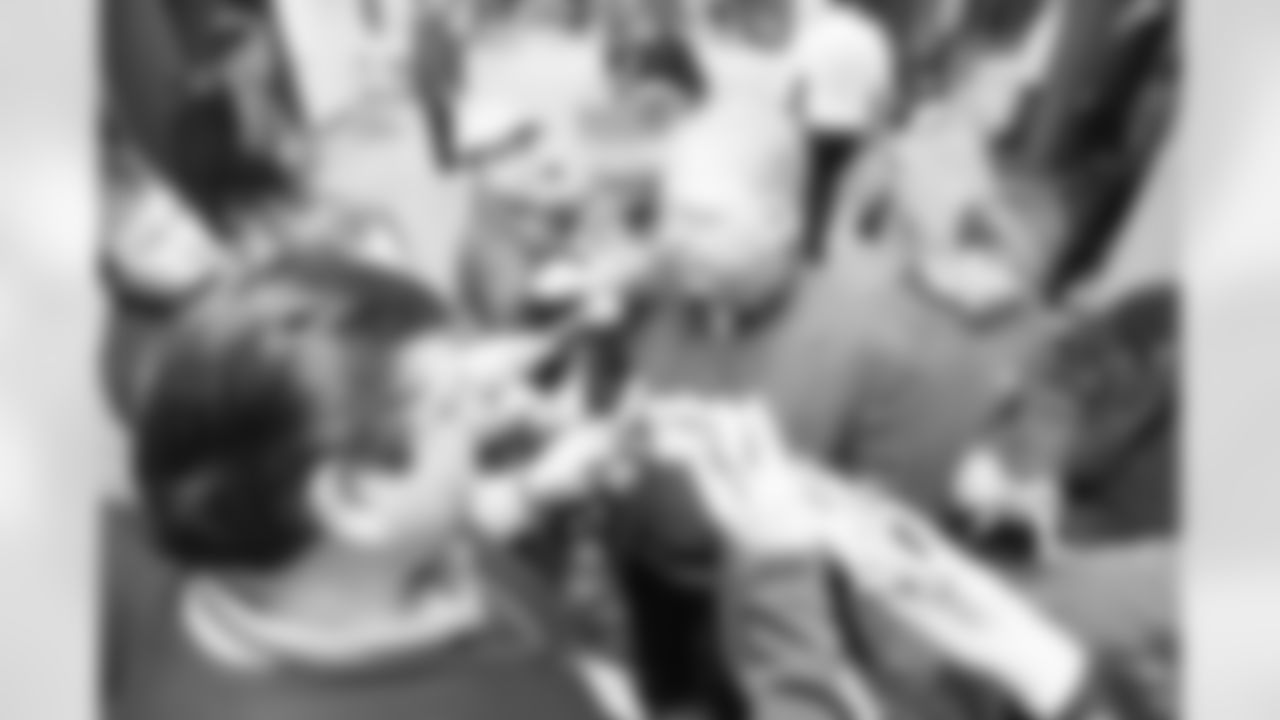 The Ravens celebrate their their historic 33-14 wild card win in New England. Head Coach John Harbaugh high-fived Ravens fans around the edge of the stadium before joining his team in the locker room.