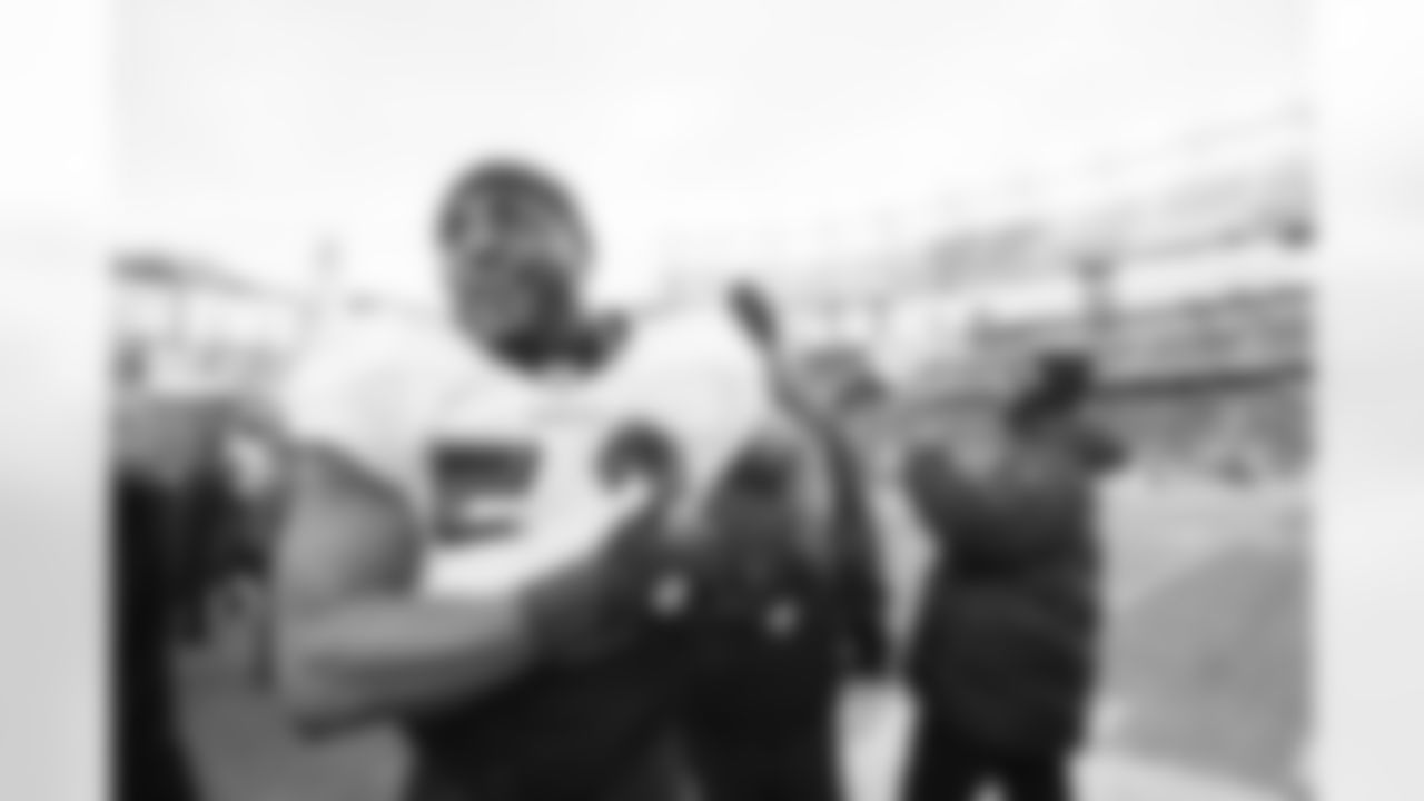 The Ravens celebrate their their historic 33-14 wild card win in New England. Head Coach John Harbaugh high-fived Ravens fans around the edge of the stadium before joining his team in the locker room.