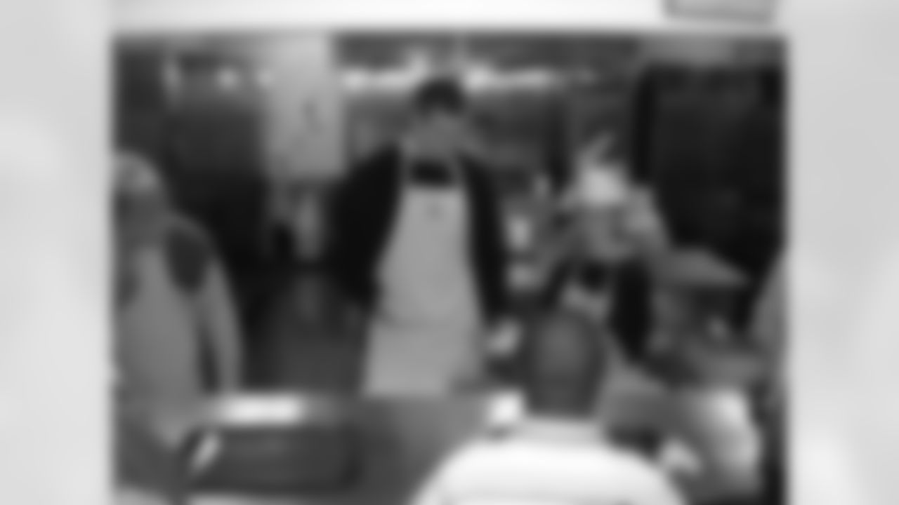 Joe Flacco serves lunch in the community at Paul's Place in November 2008.