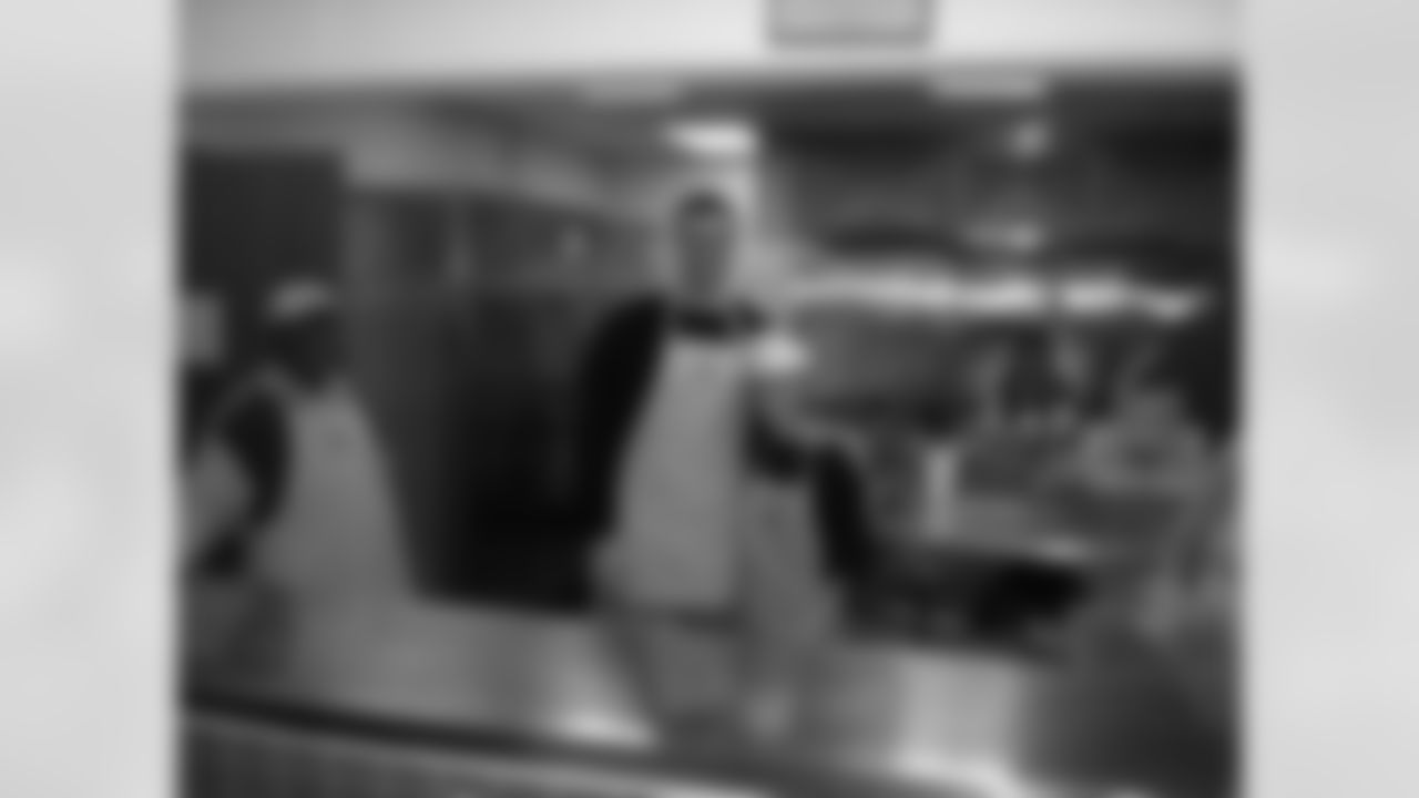 Joe Flacco serves lunch in the community at Paul's Place in November 2008.
