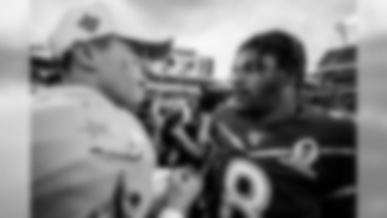 New Orleans quarterback Drew Brees and quarterback Lamar Jackson shake hands after the 2020 Pro Bowl game, Sunday, Jan. 26, 2020 in Orlando, Fla.