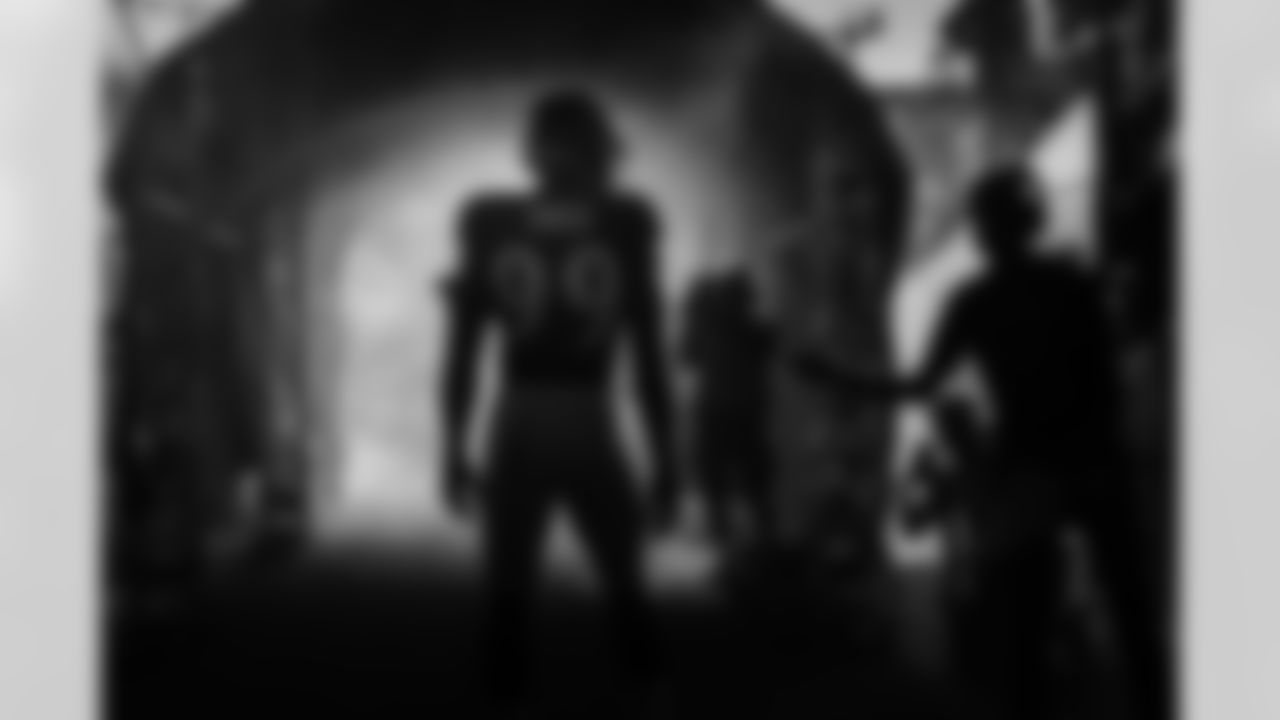 OLB Odafe Oweh (99) prepares to be introduced onto the field before a game against the New Orleans Saints at M&T Bank Stadium on August 14, 2021.