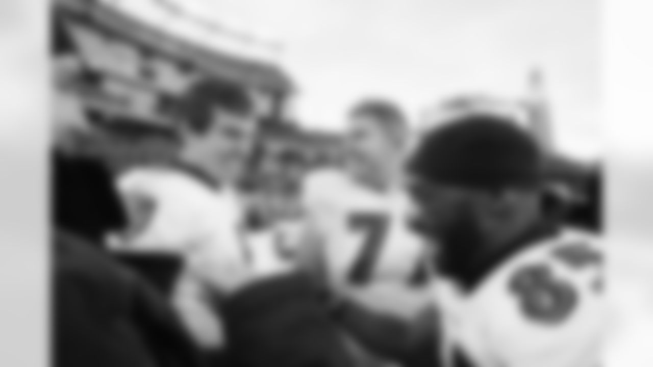 The Ravens celebrate their their historic 33-14 wild card win in New England. Head Coach John Harbaugh high-fived Ravens fans around the edge of the stadium before joining his team in the locker room.