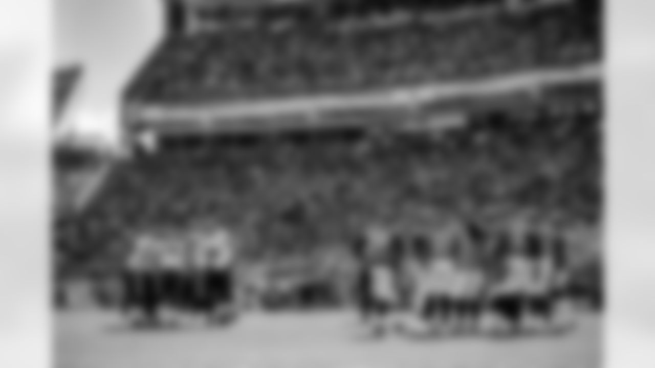 The offense huddles