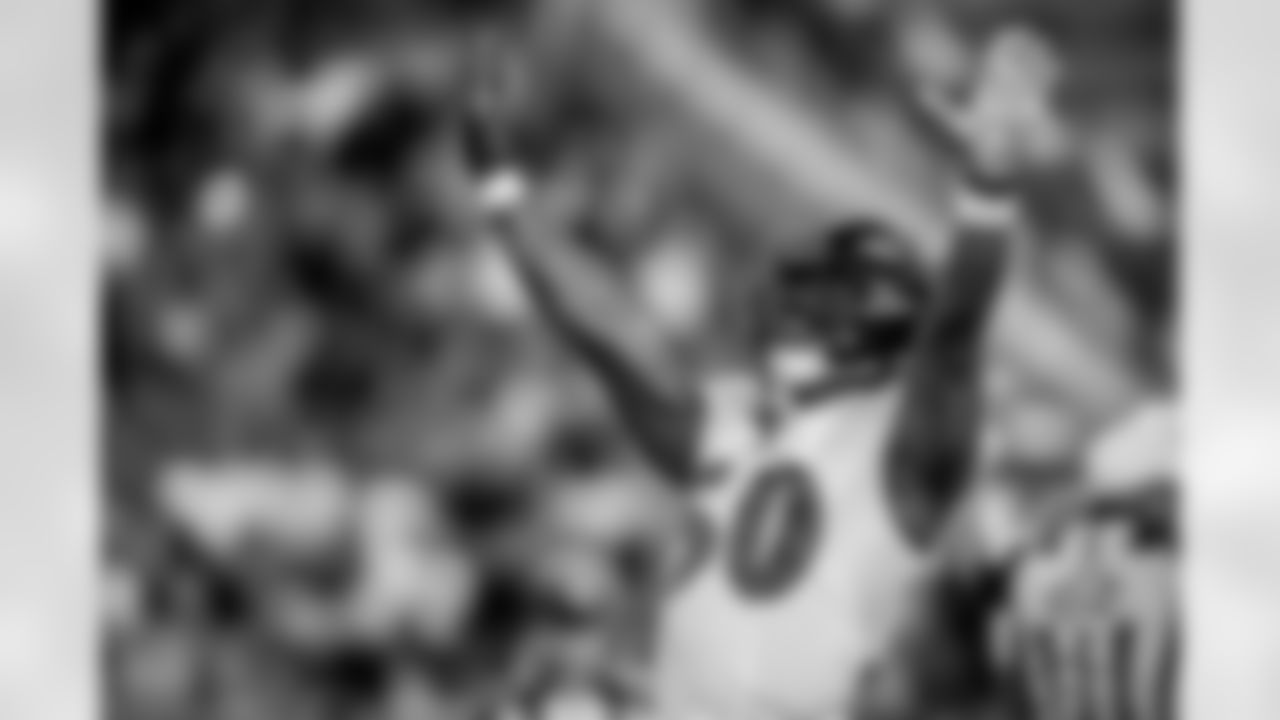 OLB Justin Houston celebrates his 100th sack