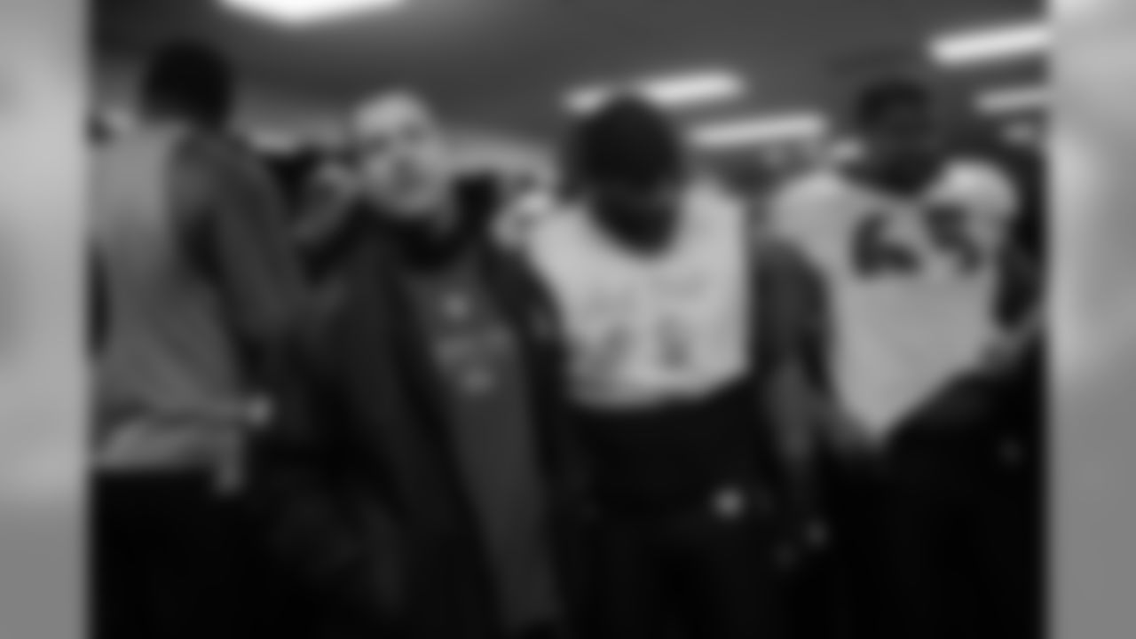 The Ravens celebrate their their historic 33-14 wild card win in New England. Head Coach John Harbaugh high-fived Ravens fans around the edge of the stadium before joining his team in the locker room.