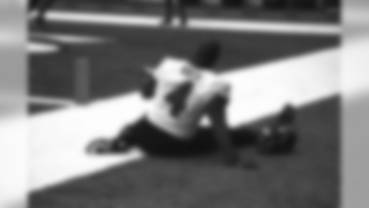 Terrell Suggs stretching in Sam Koch's #4 jersey.