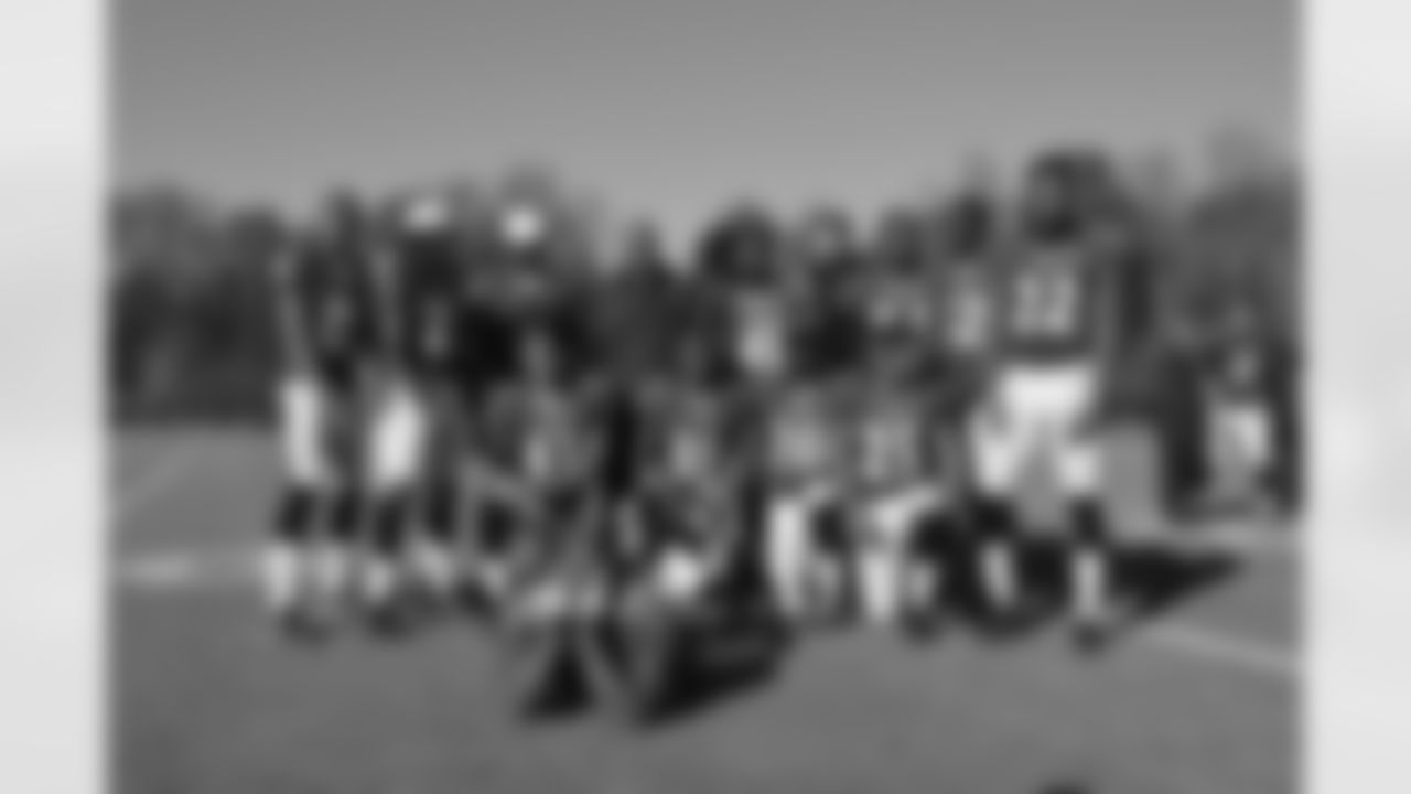 Terrell Suggs crashing the DBs position group shot.