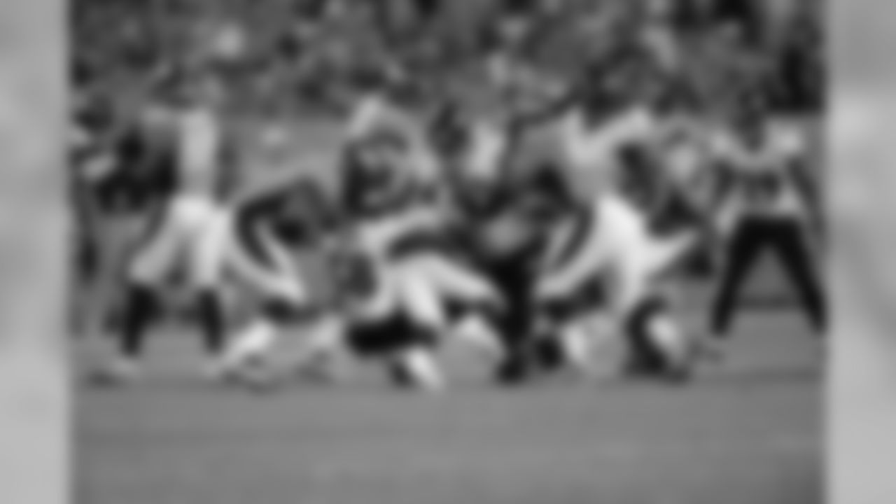 OLB Elvis Dumervil tackles one of his former teammates.