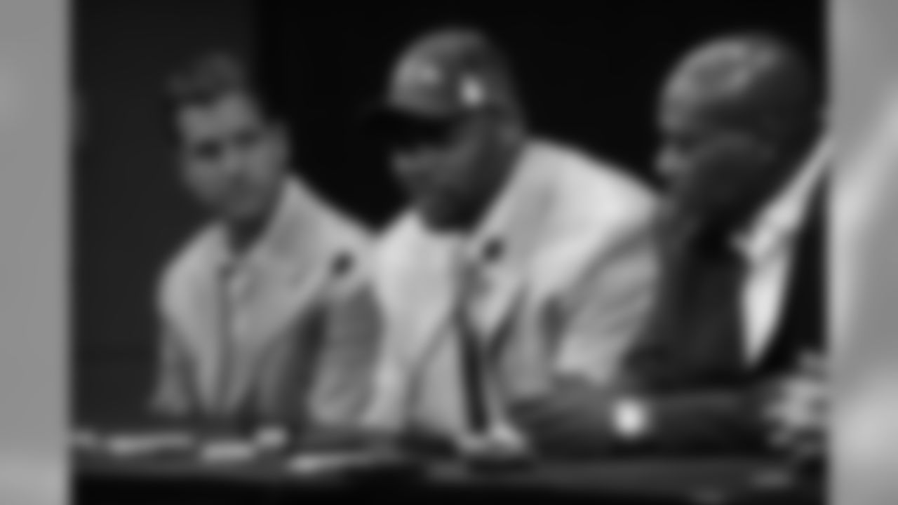 2009 Ravens first-round draft pick Michael Oher is introduced by GM Ozzie Newsome, Head Coach John Harbaugh and Director of Player Personnel Eric DeCosta at a press conference at the Ravens' Owings Mills Training Facility in April 2009.