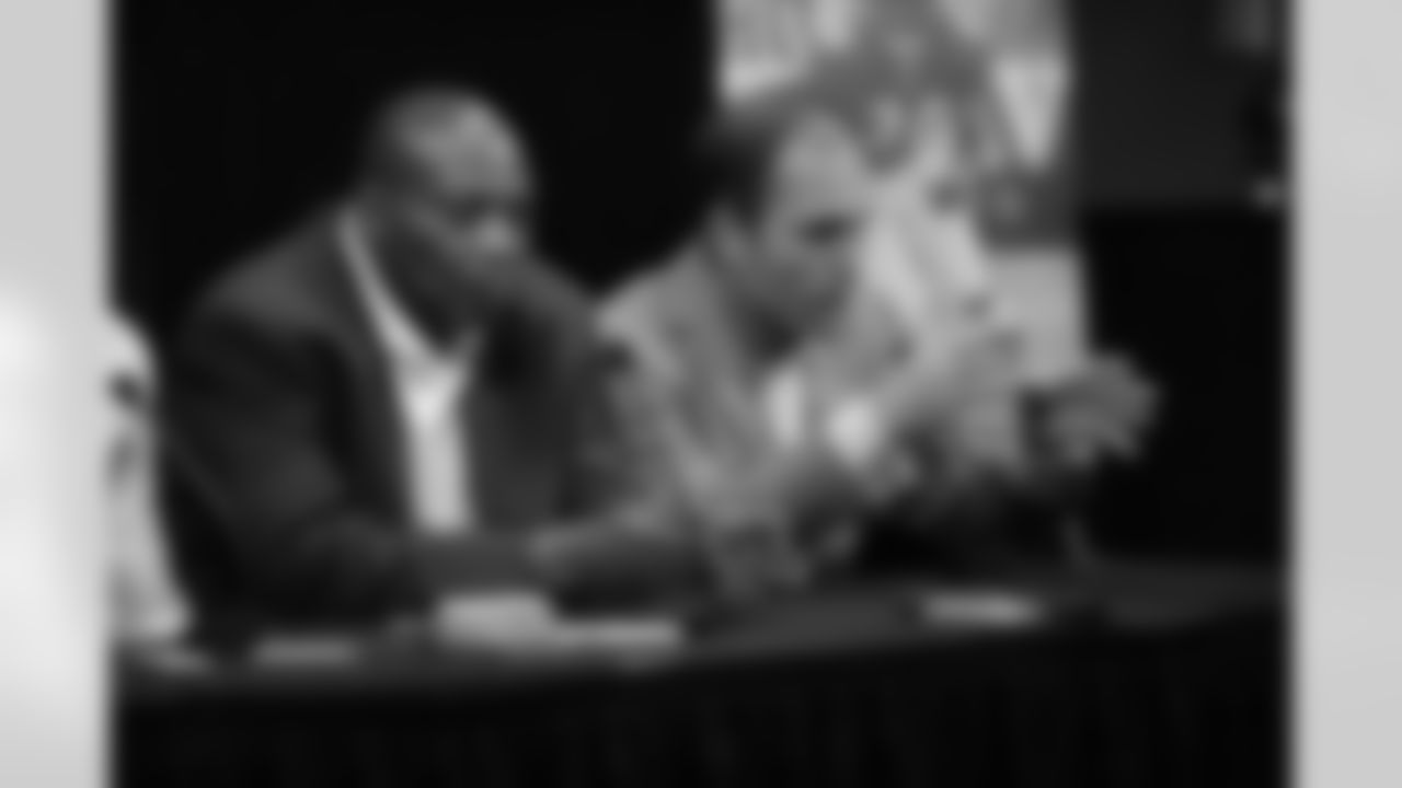 2009 Ravens first-round draft pick Michael Oher is introduced by GM Ozzie Newsome, Head Coach John Harbaugh and Director of Player Personnel Eric DeCosta at a press conference at the Ravens' Owings Mills Training Facility in April 2009.