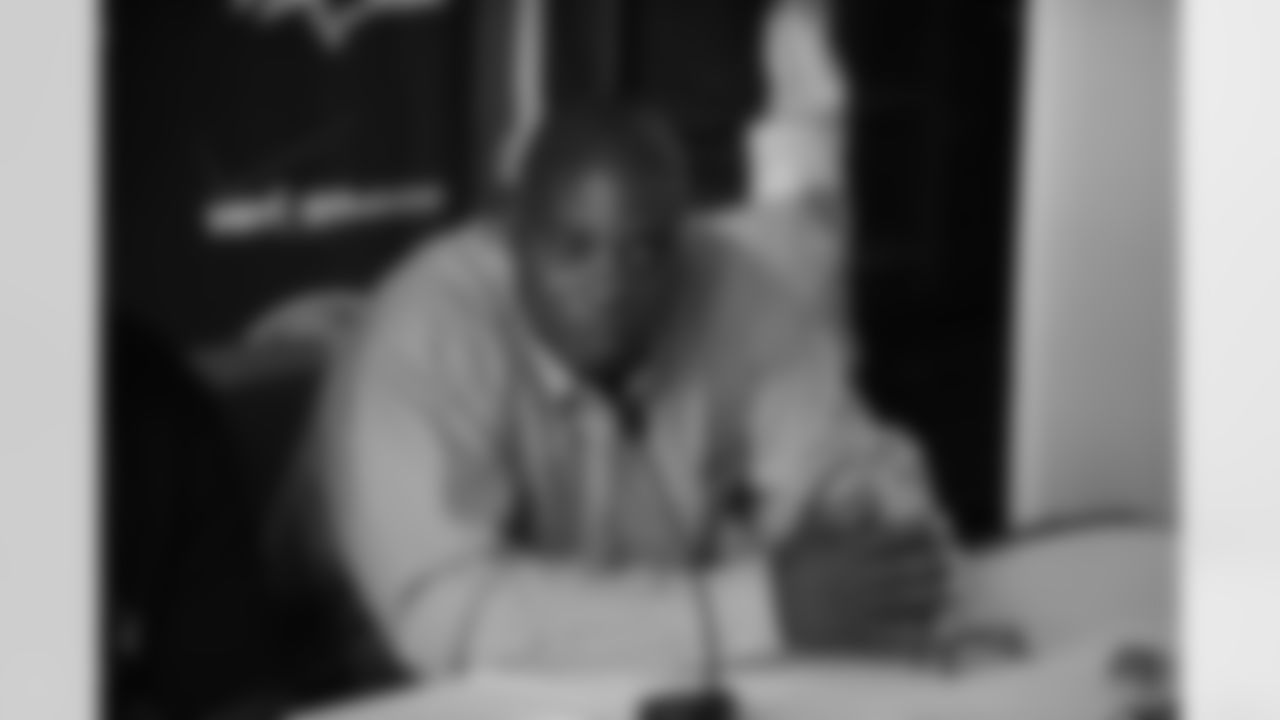 Tackle Michael Oher and General Manager & Executive VP Ozzie Newsome talk with the media during a press conference following the first-round draft pick's signing.