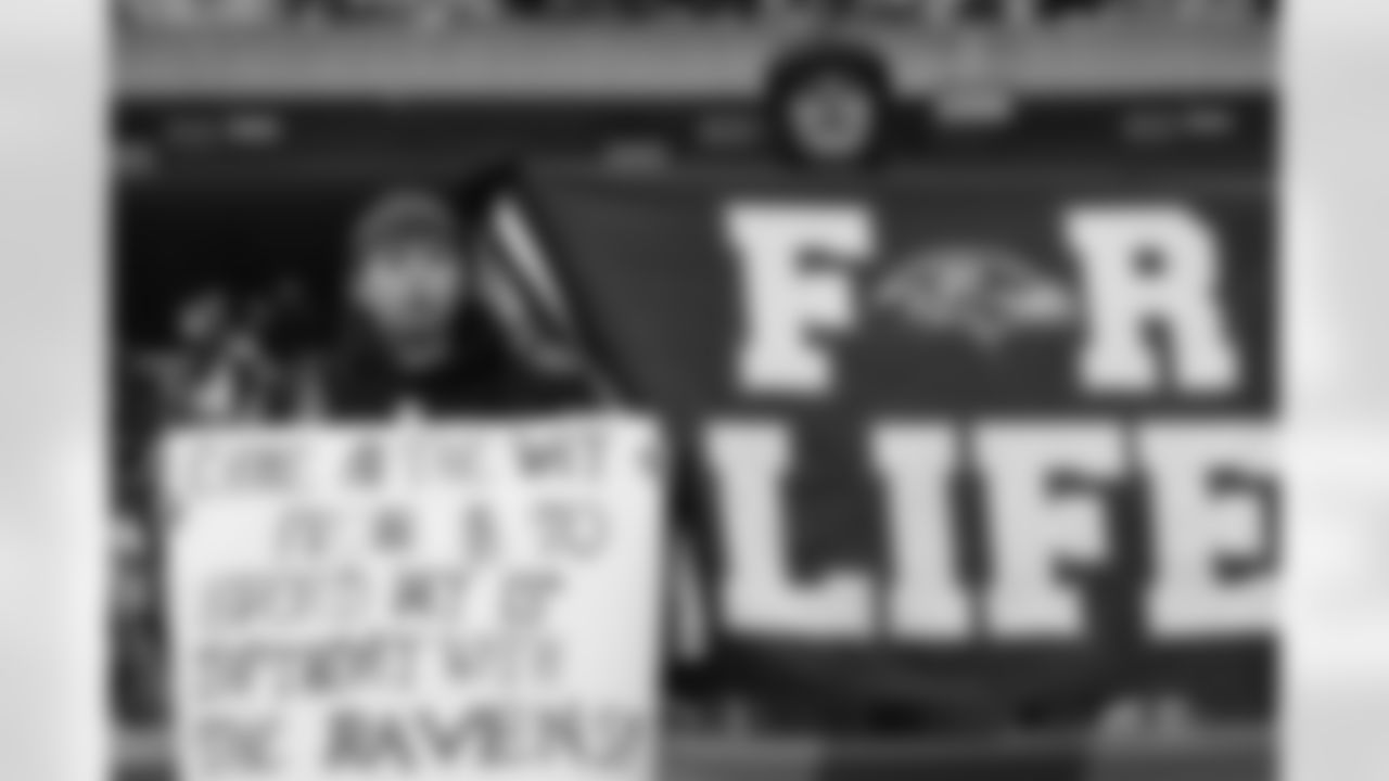 Ravens fans cheer on the players