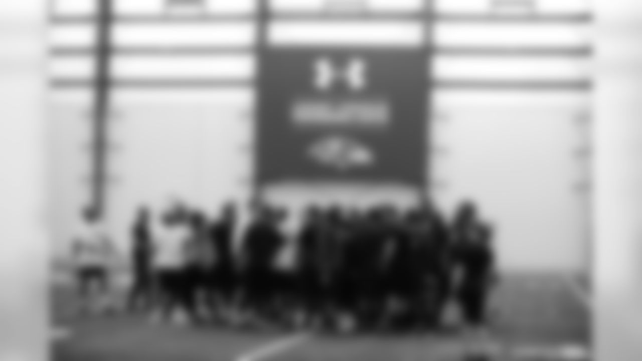 Team huddle, including Joe Flacco, Torrey Smith and Steve Smith