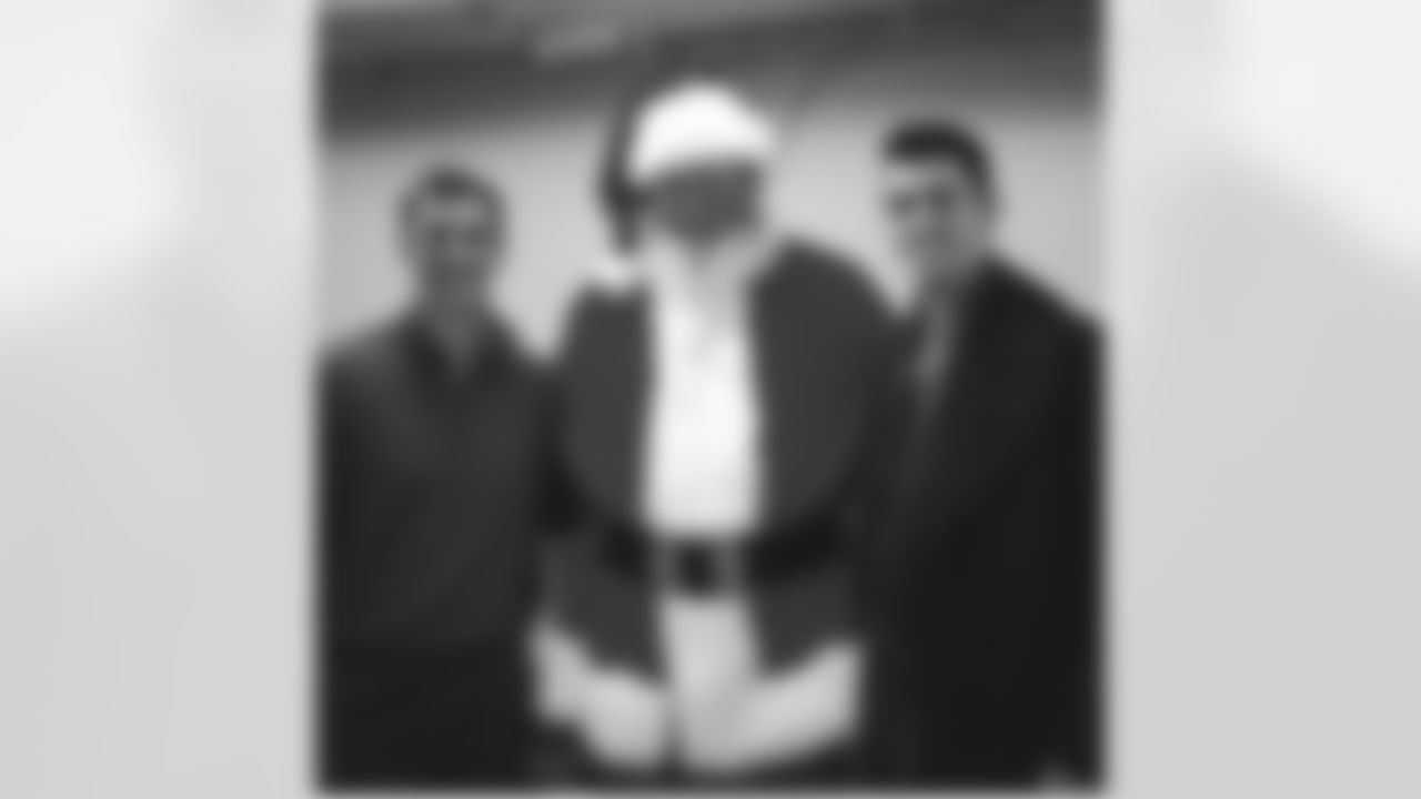 jtuck9[Justin Tucker]:Stover, Santa and me at the Festival of Trees. Had a great time reading 'The Grinch' to the kids!