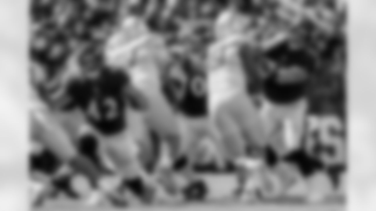 G Kevin Zeitler (70) and G/C Bradley Bozeman (77) hold the line during a game against the Los Angeles Chargers at M&T Bank Stadium on October 17, 2021.