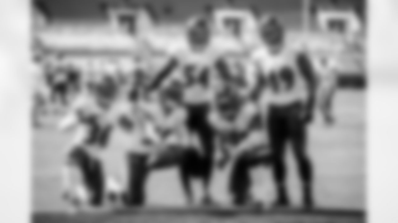 The defense celebrates a fumble recovery