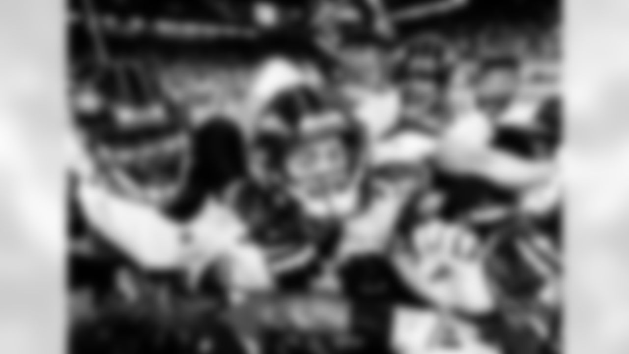 K Justin Tucker celebrates with teammates after kicking a game winning field goal