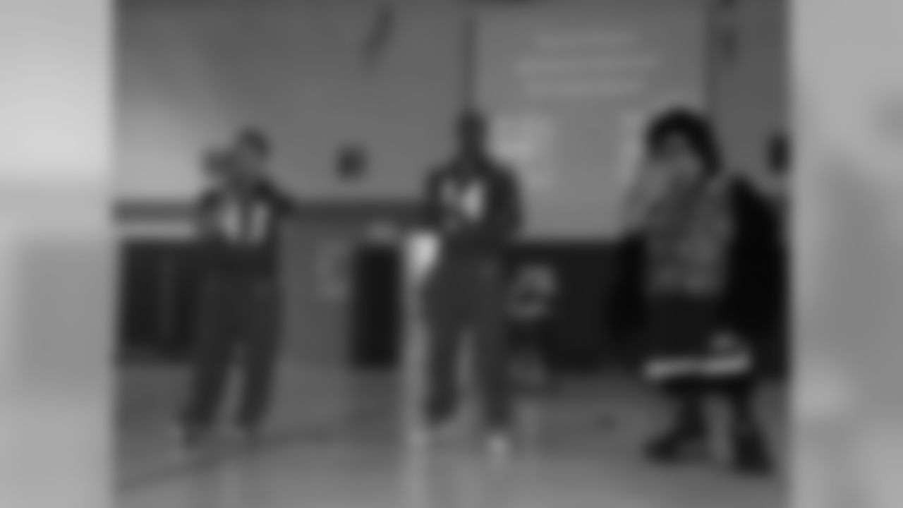 Ravens players and cheerleaders visit local schools to encourage students to be active as part of the "What Moves U" program.