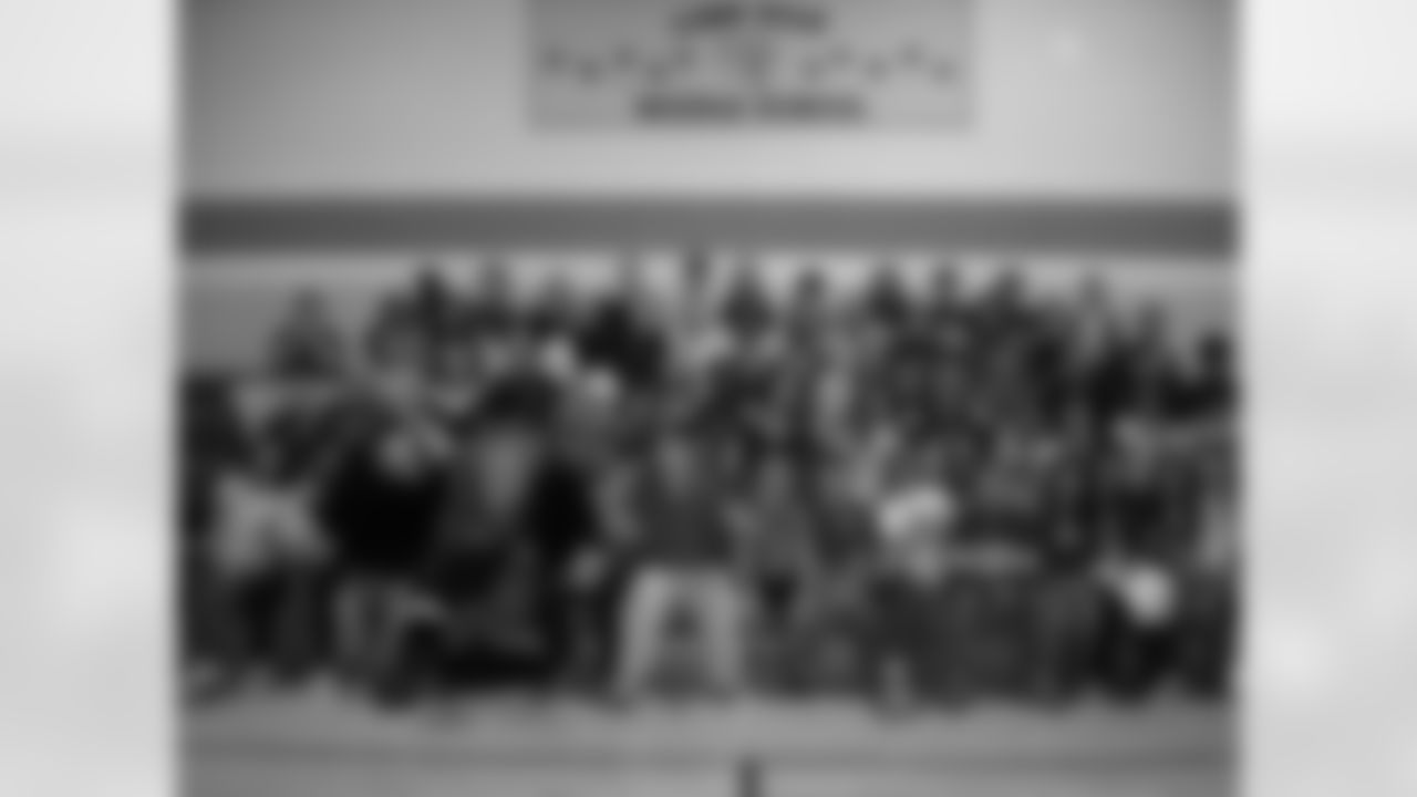 Ravens players and cheerleaders visit local schools to encourage students to be active as part of the "What Moves U" program.