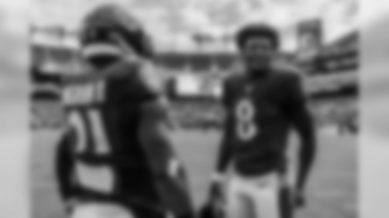 Quarterback Lamar Jackson chats with running back Mark Ingram II prior to the game against the Cincinnati Bengals on October 13, 2019.