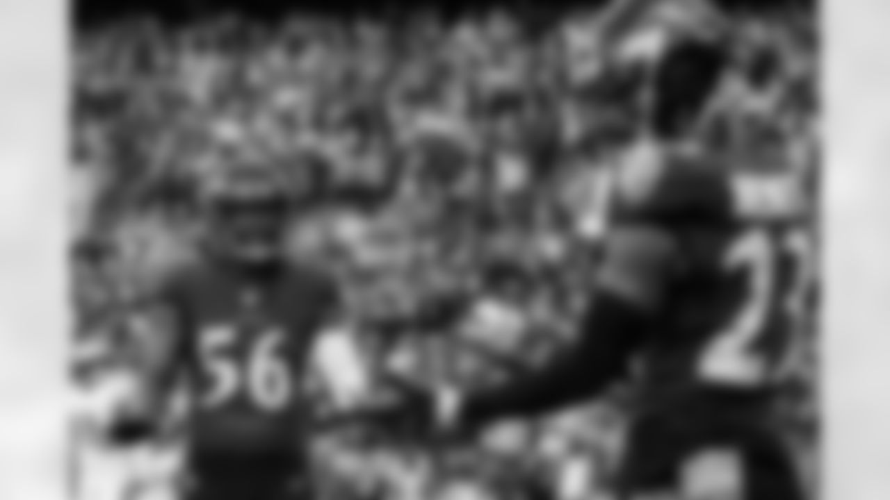 LB John Bynes (56) speaks to a teammate during a game against the Minnesota Vikings at M&T Bank Stadium on November 7, 2021.