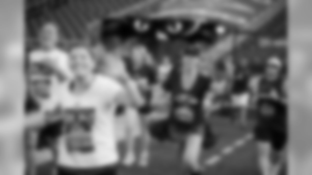 Ravens fans participate in a 5K run that ends on the field at M&T Bank Stadium.